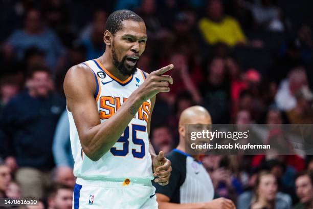 Kevin Durant of the Phoenix Suns reacts in the second quarter during their game against the Charlotte Hornets at Spectrum Center on March 01, 2023 in...