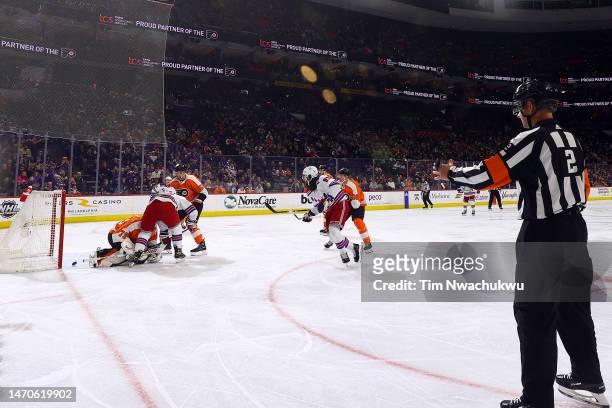 Mika Zibanejad of the New York Rangers scores past Carter Hart of the Philadelphia Flyers during the first period at Wells Fargo Center on March 01,...