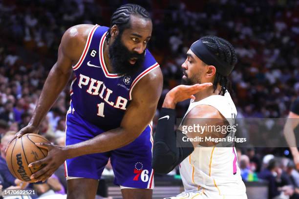 James Harden of the Philadelphia 76ers drives against Gabe Vincent of the Miami Heat during the second quarter of the game at Miami-Dade Arena on...