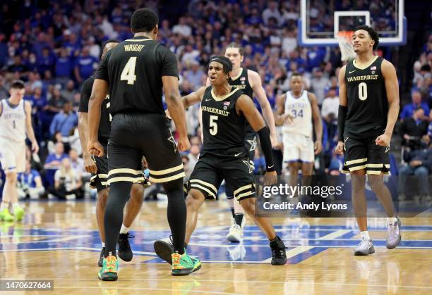 Ezra Manjon and Tyrin Lawrence of the Vanderbilt Commodores celebrate after the game winning shot by Jordan Wright in the final seconds of the 68-66...