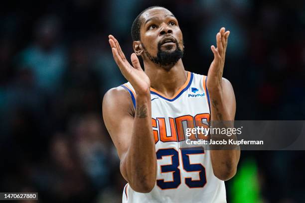 Kevin Durant of the Phoenix Suns reacts in the fourth quarter during their game against the Charlotte Hornets at Spectrum Center on March 01, 2023 in...