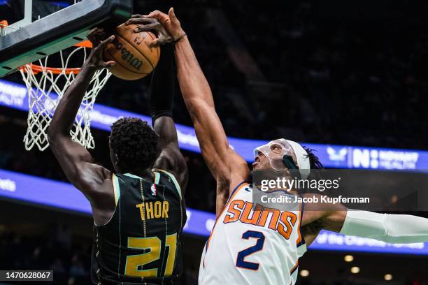 Josh Okogie of the Phoenix Suns blocks a shot from JT Thor of the Charlotte Hornets in the third quarter during their game at Spectrum Center on...