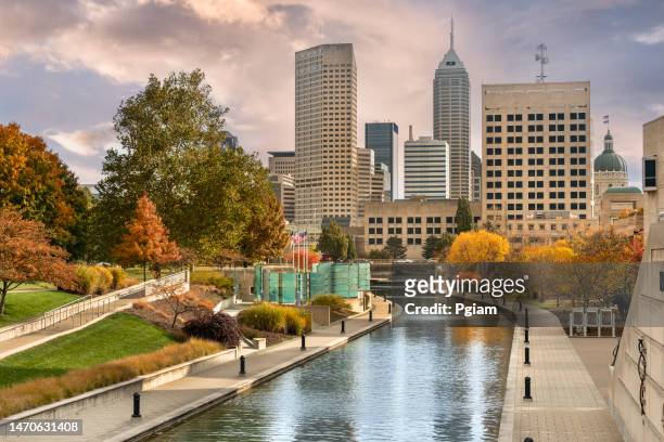 downtown city skyline view of indianapolis, indiana, usa looking over the central canal walk - indianapolis canal stock pictures, royalty-free photos & images