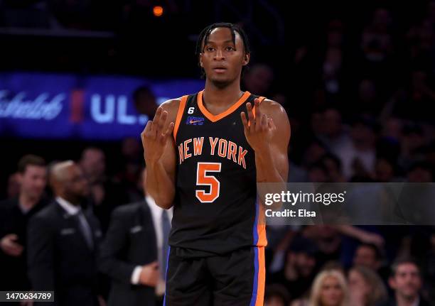 Immanuel Quickley of the New York Knicks celebrates teammate Jalen Brunson's three point shot late in the fourth quarter against the Brooklyn Nets at...