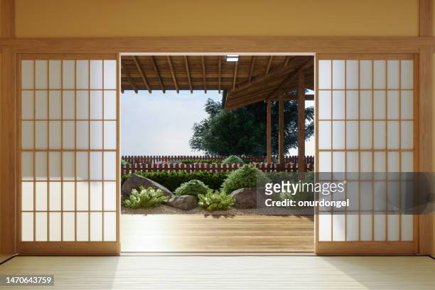 japanese style empty room interior with garden view background - tatami mat stockfoto's en -beelden