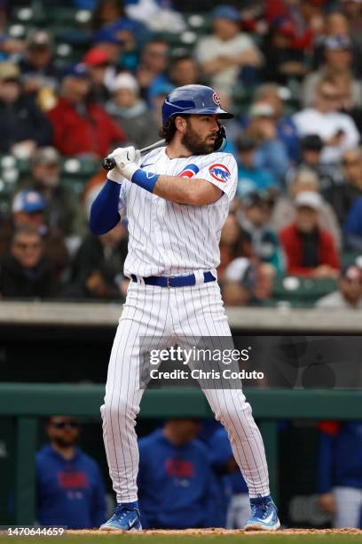 Dansby Swanson of the Chicago Cubs bats during the fourth inning of a spring training game against the Seattle Mariners at Sloan Park on March 01,...