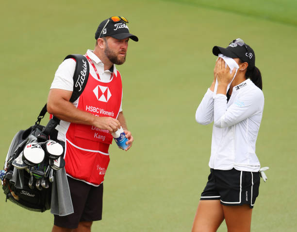 https://media.gettyimages.com/id/1470648925/photo/danielle-kang-of-the-united-states-reacts-as-she-stands-with-her-caddie-on-the-eighteenth.jpg?s=612x612&w=0&k=20&c=6xje3t9ScmMQP-AcU5Yfp4OagMaze5zyoNAc2C-bU64=