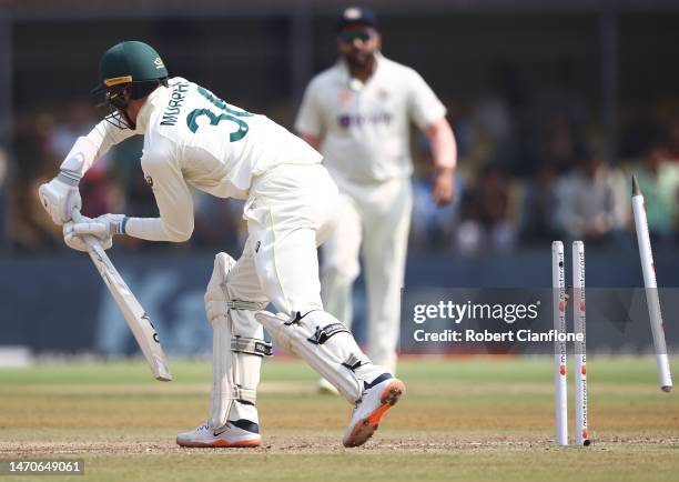 Todd Murphy of Australia is bowled by Umesh Yadav of India during day two of the Third Test match in the series between India and Australia at...