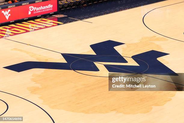 The West Virginia Mountaineers logo on the floor before a college basketball game against the Oklahoma State Cowboys at the WVU Coliseum on February...