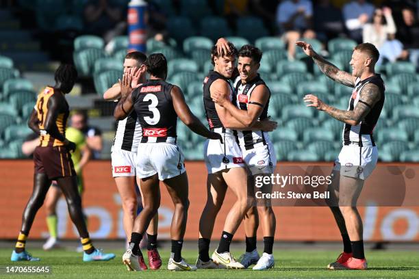 Patrick Lipinski of the Magpies celebrates a goal during the AFL practice match between the Hawthorn Hawks and the Collingwood Magpies at University...