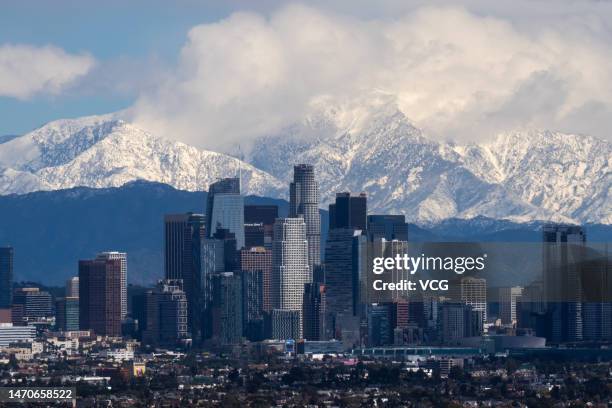 Clouds hover in the background of downtown Los Angeles skyline on March 1, 2023 in Los Angeles, CA.