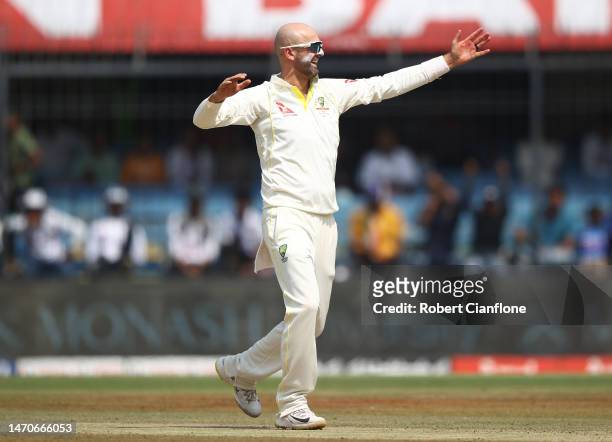 Nathan Lyon of Australia celebrates taking the wicket of Rohit Sharma of India during day two of the Third Test match in the series between India and...