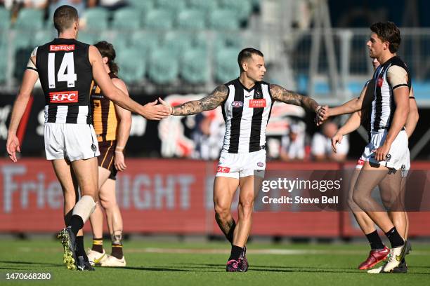 Jamie Elliott of the Magpies celebrates a goal during the AFL practice match between the Hawthorn Hawks and the Collingwood Magpies at University of...