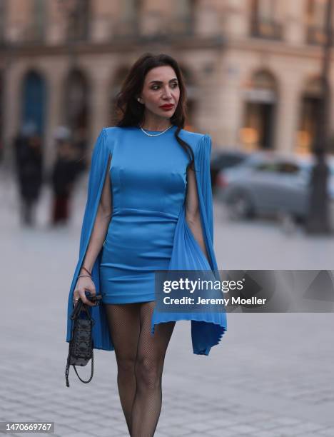 Marina Theodoridou seen wearing blue minidress with sleeves Alex Perry, silver jewellery Yeprem and Stefere before Dior show during Paris Fashion...