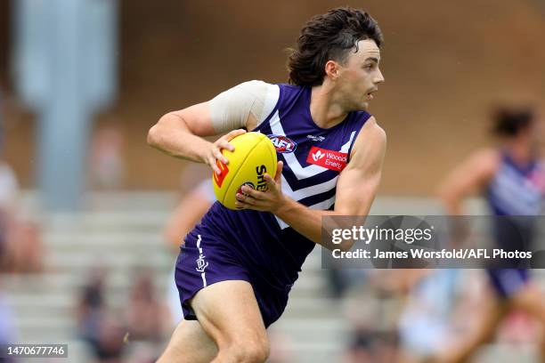 Jordan Clark of the Dockers runs with ball down the ground during the AFL Practice Match between the Fremantle Dockers and the Port Adelaide Power at...