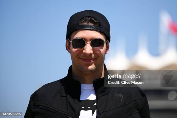 Esteban Ocon of France and Alpine F1 looks on in the Paddock during previews ahead of the F1 Grand Prix of Bahrain at Bahrain International Circuit...