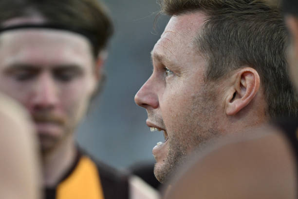 Sam Mitchell, Senior Coach of the Hawks addresses the team during the AFL practice match between the Hawthorn Hawks and the Collingwood Magpies at...