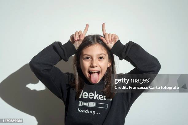 little girl making a funny face - pull a face stock pictures, royalty-free photos & images