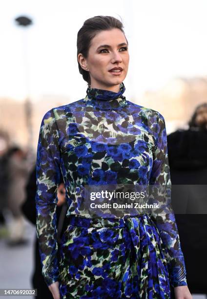 Zita d'Hauteville is seen wearing a blue and yellow sheer floral Dries Van Noten dress outside the Dries Van Noten show during Paris Fashion Week F/W...