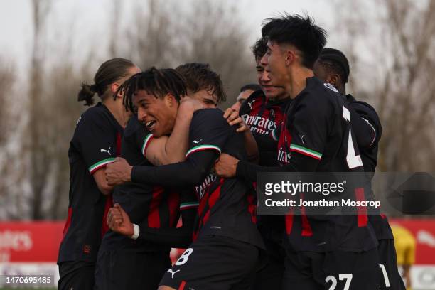 Kevin Zeroli of AC Milan celebrates with team mates after scoring to give the side a 1-0 lead during the UEFA Youth League Round of 16 tie between AC...