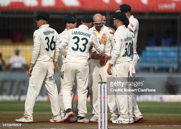 Nathan Lyon of Australia celebrates taking the wicket of during day two of the Third Test match in the series between India and Australia at Holkare...