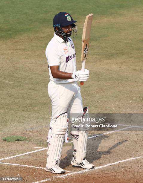Cheteshwar Pujara of India celebrates after scoring his half century during day two of the Third Test match in the series between India and Australia...