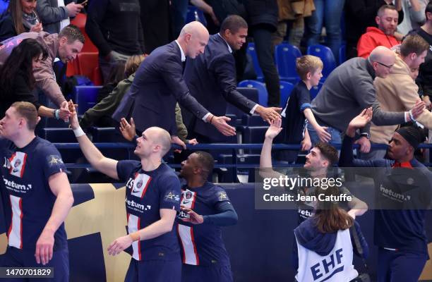 Thierry Omeyer, Daniel Narcisse congratulate their players following the EHF Champions League match between Paris Saint Germain and Veszprem KSE at...