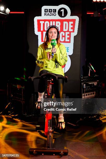 Radio presenter Arielle Free in BBC Radio 1 studio on a exercise bike in preparation for the Red Nose Day 2023 challenge, 'Tour De Dance' on February...