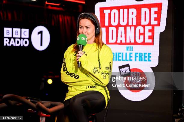 Radio presenter Arielle Free in the BBC Radio 1 studio on a exercise bike in preparation for the Red Nose Day 2023 challenge, 'Tour De Dance' on...