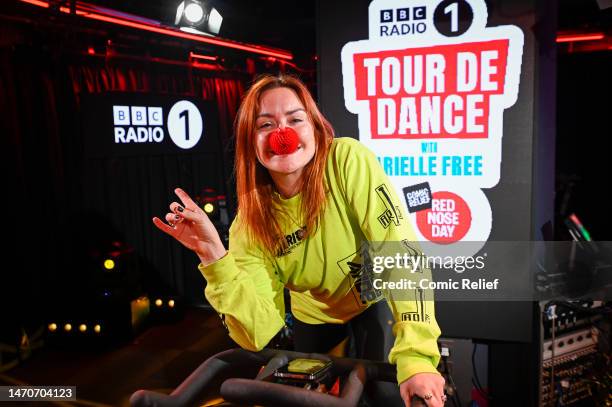 Radio presenter Arielle Free in the BBC Radio 1 studio on a exercise bike in preparation for the Red Nose Day 2023 challenge, 'Tour De Dance' on...