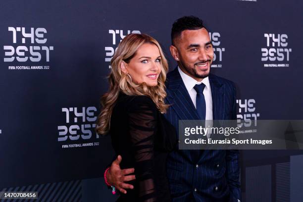 Dimitri Payet and Ludivine Payet pose for photos during the Green Carpet Arrivals prior The Best FIFA Football Awards 2022 on February 27, 2023 in...