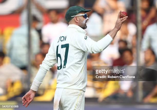 Nathan Lyon of Australia holds up the ball after he took eight wickets in the second innings during day two of the Third Test match in the series...