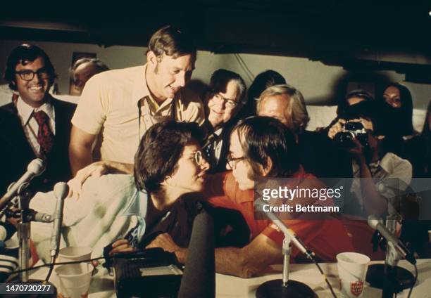 Tennis players Billie Jean King and Bobby Riggs get ready to kiss and make up during a press conference following the 'Battle of the Sexes' match at...