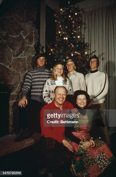 Congressman Gerald Ford and his wife, Betty pose with their children Jack, Susan, Steven and Mike at their ski resort home in Vail, Colorado, during...