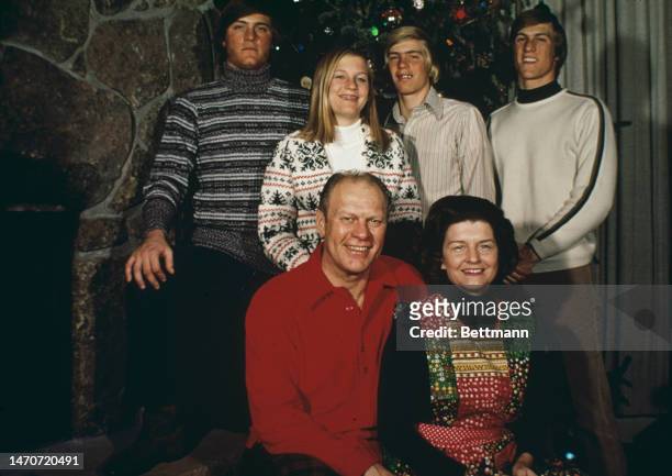 Congressman Gerald Ford and his wife Betty pose with their children Jack, Susan, Steven and Mike at their ski resort home in Vail, Colorado, during...