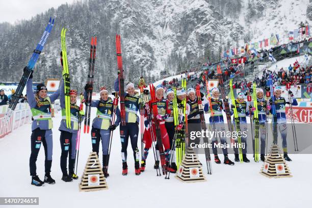 Silver medalists Team Germany, gold medalists Team Norway and bronze medalists Team Sweden pose for a photo after the Cross-Country Women's 4x5km...