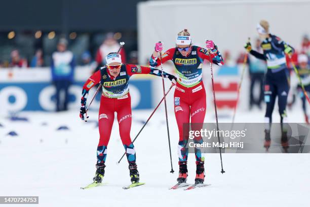 Ingvild Flugstad Oestberg of Team Norway changes over to Anne Kjersti Kalvaa of Team Norway during the Cross-Country Women's 4x5km Relay Classic/Free...