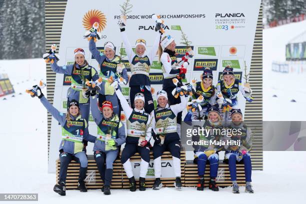 Silver medalists Team Germany, gold medalists Team Norway and bronze medalists Team Sweden celebrate during the victory ceremony for the...