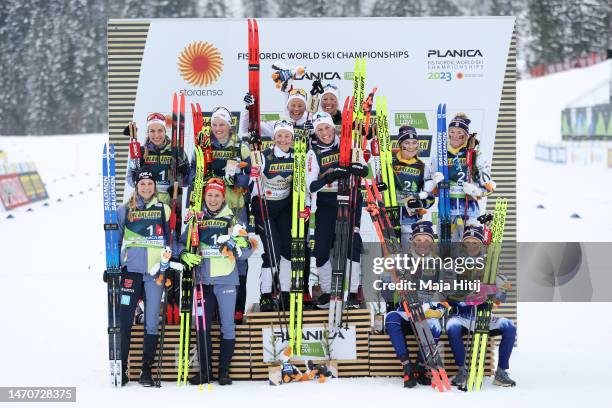 Silver medalists Team Germany, gold medalists Team Norway and bronze medalists Team Sweden pose for a photo during the victory ceremony for the...