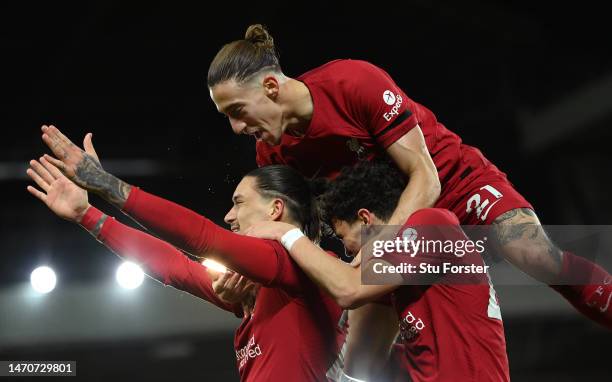 Liverpool player Darwin Nunez celebrates with Stefan Bajcetic and Kostas Tsimikas after scoring the opening goal which is later disallowed after a...