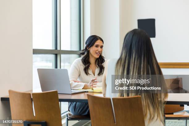 female business owner asks unrecognizable female job applicant questions - student advisor stock pictures, royalty-free photos & images