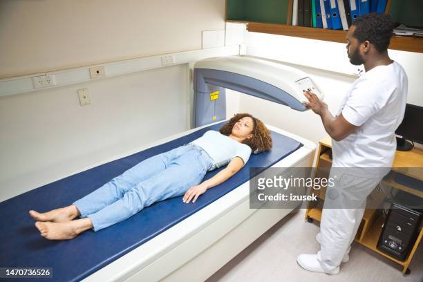woman during densitometry - examination table stock pictures, royalty-free photos & images