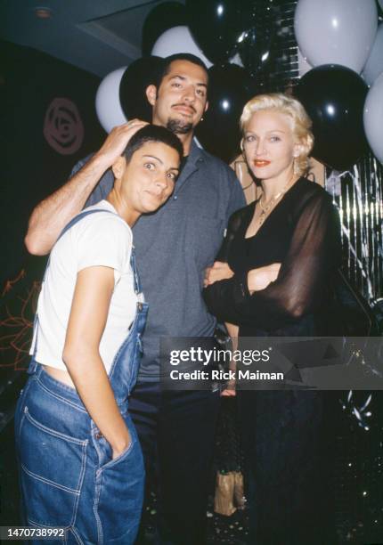 Madonna during Vibe Magazine first Anniversary. On the left, her girlfriend : Ingrid Casares and, Guy Osceary, a friend.