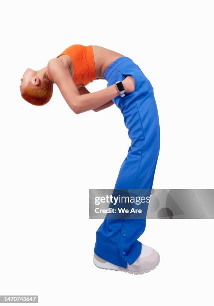 bending over backwards - hands in pockets stock pictures, royalty-free photos & images