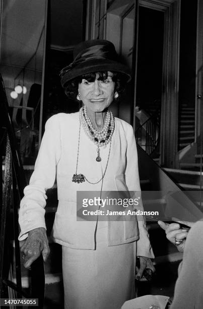 French Fashion Designer Coco Chanel at home.