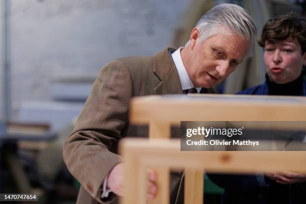 King Philippe of Belgium visits the Recyclart social economy project for handicrafts, martial arts and culinary experiences on March 2, 2023 in...