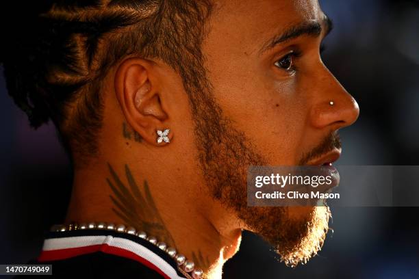 Lewis Hamilton of Great Britain and Mercedes talks to the media in the Paddock during previews ahead of the F1 Grand Prix of Bahrain at Bahrain...