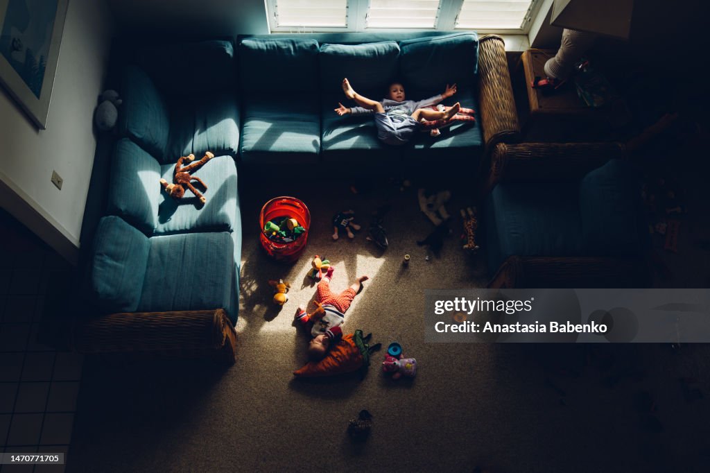 Baby girl laying down in living room