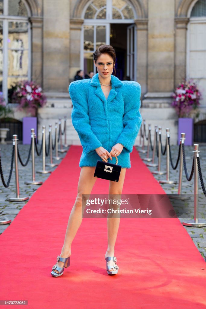 coco-rocha-wears-blue-jacket-with-wide-shoulder-bag-and-sandals-roger-vivier-at-maison-de.jpg