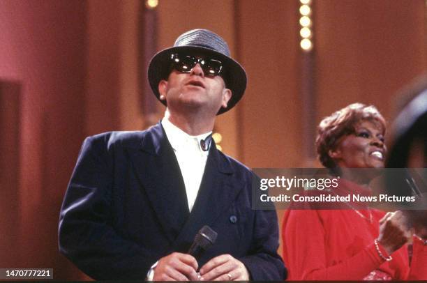 British musician Elton John performs onstage during 'AIDS Concert '88' at the John F Kennedy Center for the Performing Arts, Washington DC, June 12,...